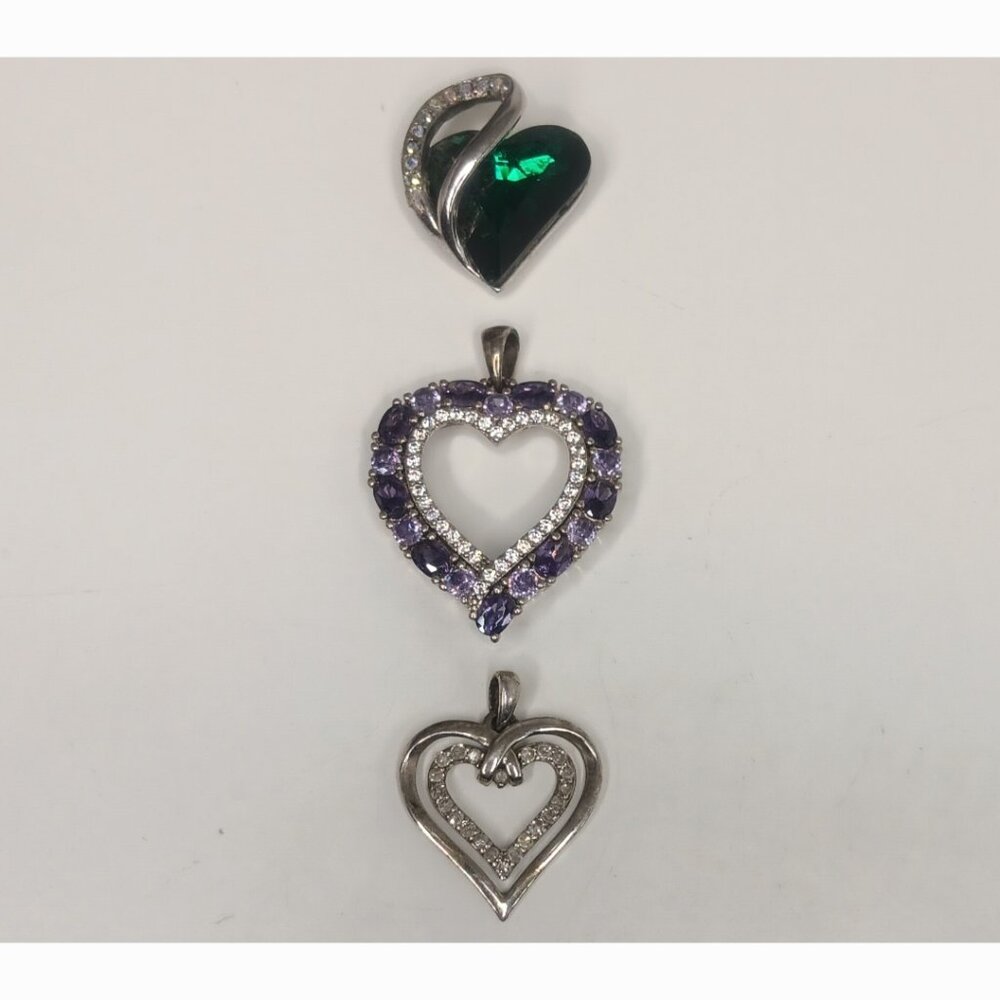 THREE SHINY HEART PENDANTS FREE WITH PURCHASE